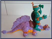 Cave Turtle Mike (with Silly Stegosaurus) from Teenage Mutant Ninja Turtles - Cave Turtles manufactured by Playmates [Loose]