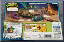 Cave Turtle Mike (with Silly Stegosaurus) from Teenage Mutant Ninja Turtles - Cave Turtles manufactured by Playmates [Back]
