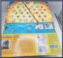 Safari Michelangelo  from Teenage Mutant Ninja Turtles - Adventurers (with Coins) manufactured by Playmates [Back]